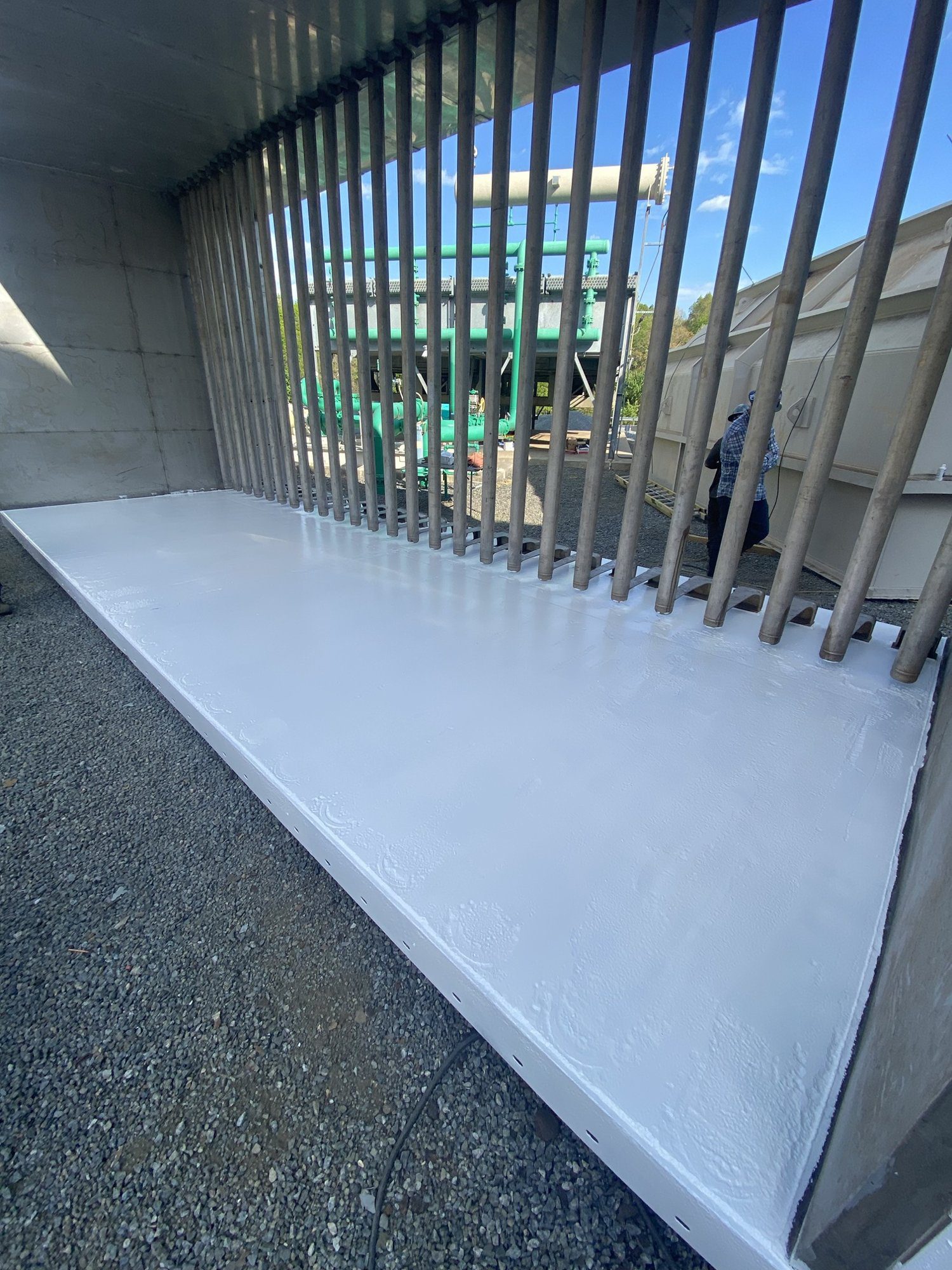 Silencer floor coated with white Sherwin-Williams Macropoxy 646 epoxy, baffles in place