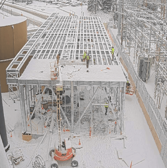 Snow on 304 stainless cooling tower basin first cell during GSM Industrial field install Rochester NY winter