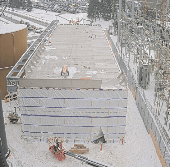 Snow on 304 stainless cooling tower basin third and fourth cells during GSM Industrial AWS D1.1 cold-weather field welding